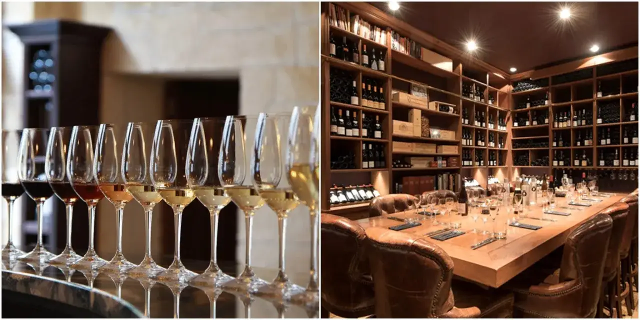 Verres de vin alignés pour une dégustation à Paris. Une salle de réception élégante avec une grande table et des étagères remplies de bouteilles.